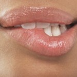 beautiful full lips of a light-skinned female music fan - biting the lower lip - sexy