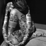 Sexy woman with sheet music tattoos