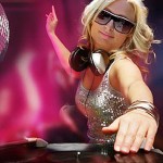 Female DJ in fashin sunglasses scratching on turntable 